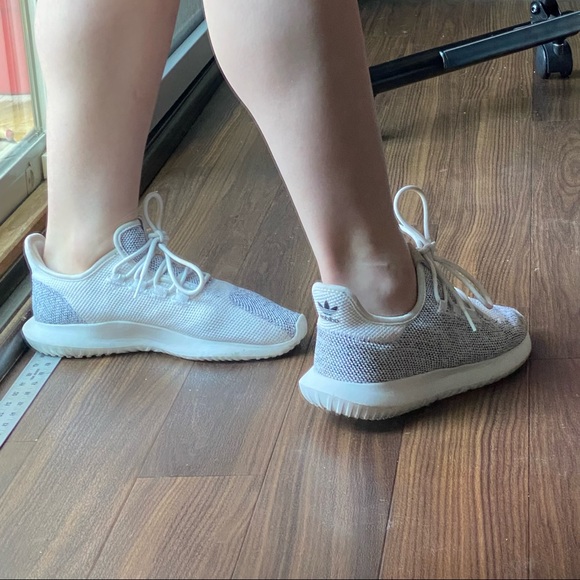 White and grey adidas tubular tennis shoes